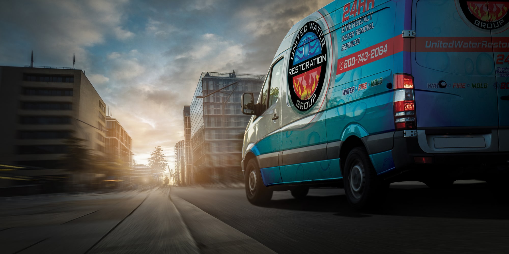 A United Water Restoration Group of Salisbury van heading out on an emergency call at sunset